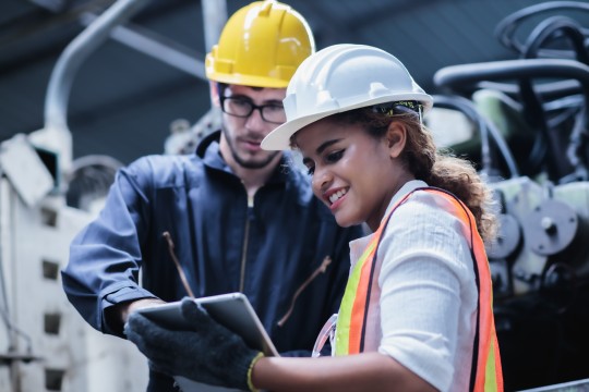 two workers discussing