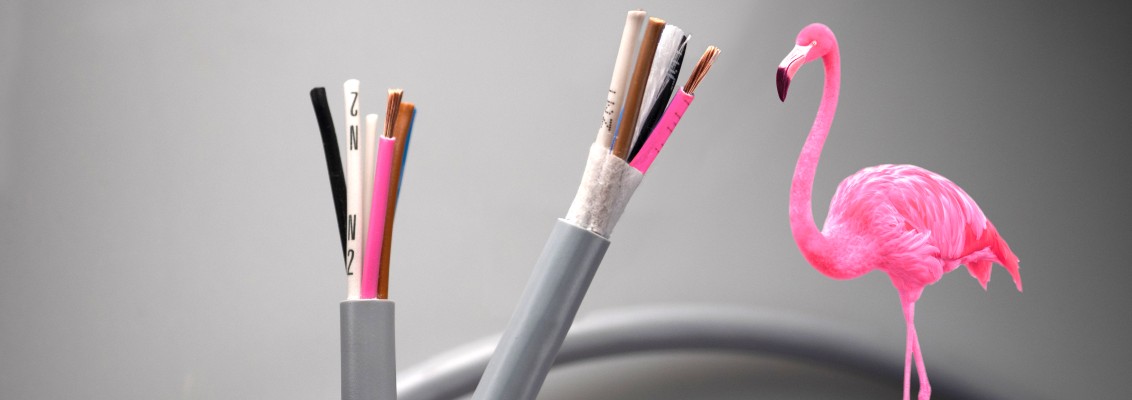Cable with pink wire next to a pink flamingo