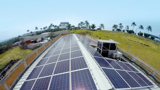 Exterior shot of the Audifarma roof with solar panels on top