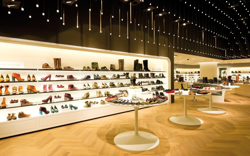 A shoe store with many lights