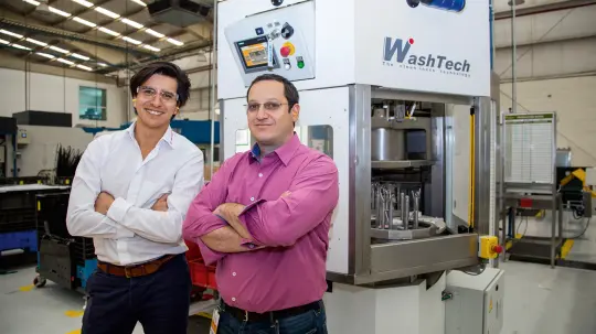 Gerardo Montenegro Aznar and Mathieu Fresco in front of the machine Gerardo Montenegro Aznar and Mathieu Fresco in front of the machine