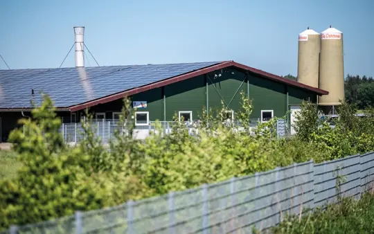 Agricultural building with solar panels on the roof